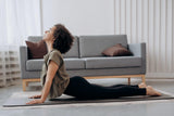 Woman doing yoga in her home