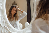 Woman looking in the mirror