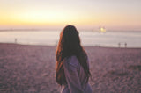 Woman on beach with long brown hair