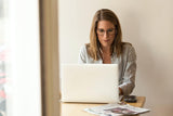 Woman typing at computer