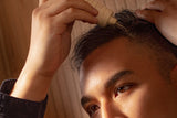 Derek Yuen applying VEGAMOUR GRO+ Advanced Scalp Detoxifying Serum