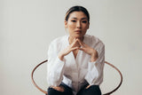 Young woman sitting on chair