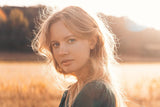 Woman with blonde frizzy hair