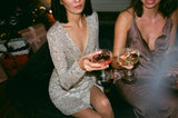 Two women toasting champagne on new year's eve