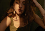 Woman touching her brown hair